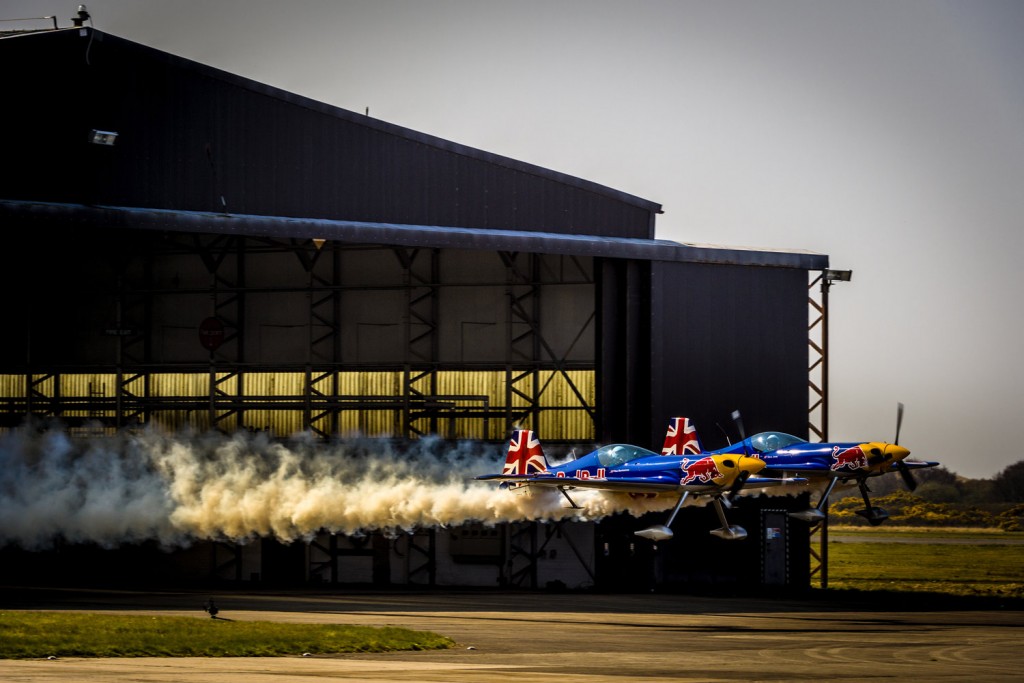 Paul Bonhomme and Steve Jones fly through a hangar during Red Bull Barnstorming photoshooting in Llandbedr, Wales, UK, on April the 09th, 2015